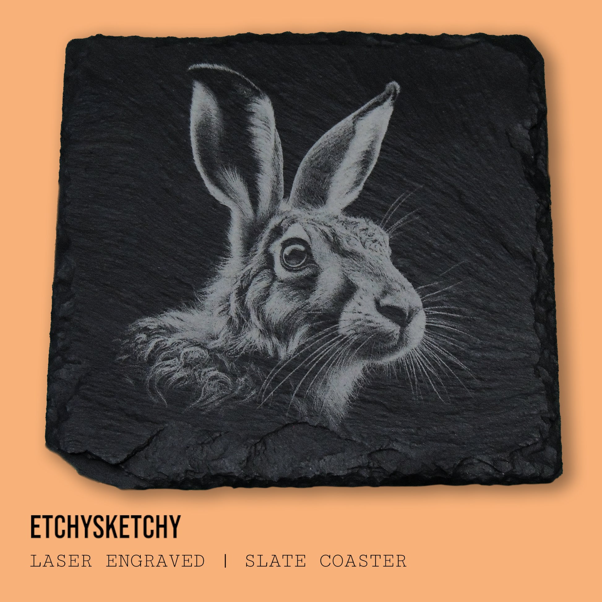 Elegant hare design laser-engraved, symbolizing agility and the quiet beauty of nature. "A 100mm x 100mm slate coaster featuring a laser-engraved hare face, with detailed fur and expressive features."
