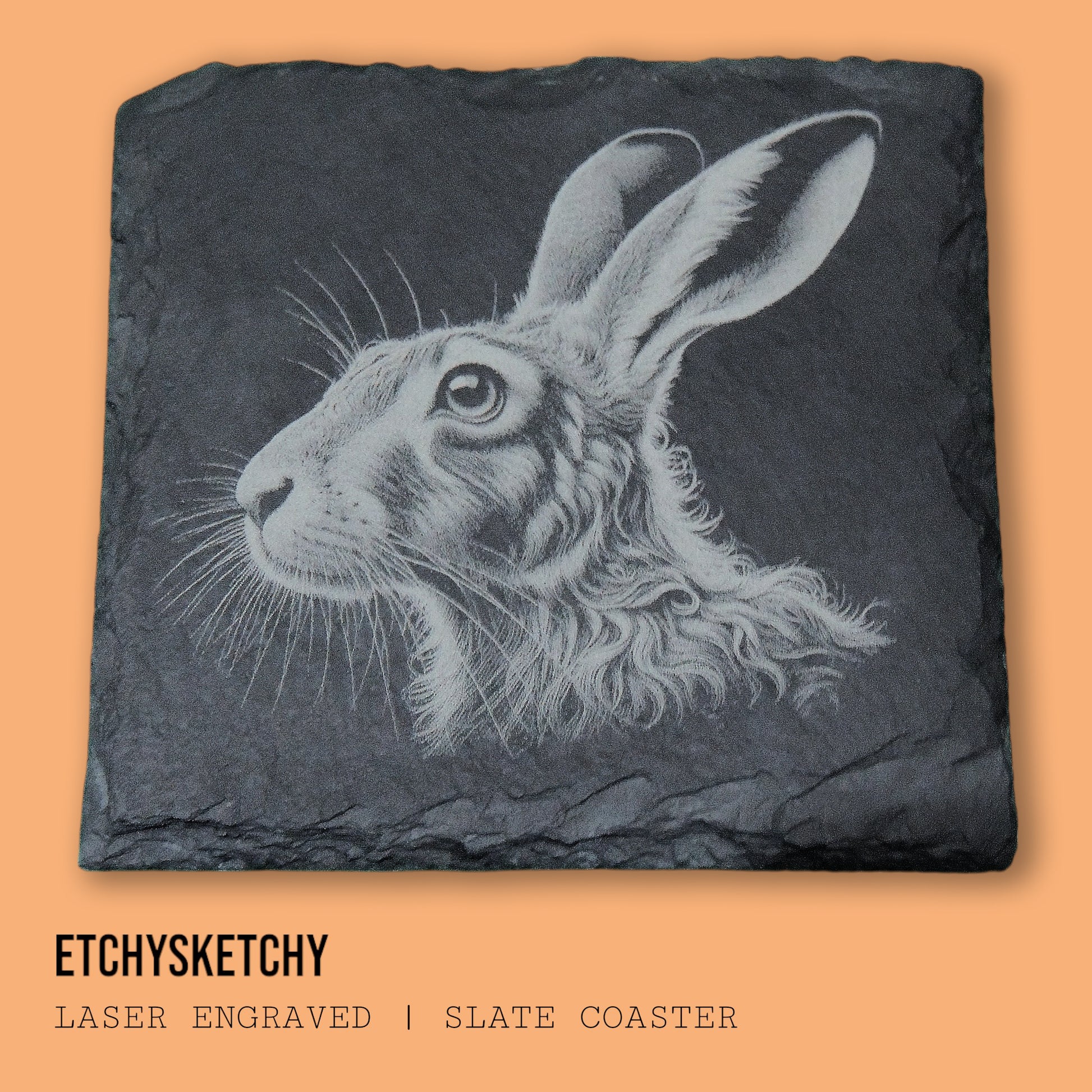 Elegant hare design laser-engraved, symbolizing agility and the quiet beauty of nature. "A 100mm x 100mm slate coaster featuring a laser-engraved hare face, with detailed fur and expressive features."